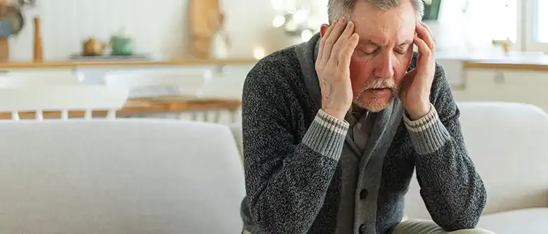 man suffering from side effects